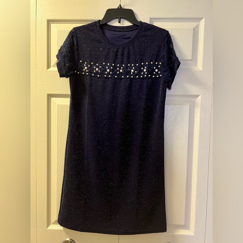 A blue dress with bright accents can be a striking and eye-catching choice.